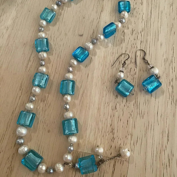 This necklace and earring set features aqua blue molded glass beads and a pearl— - Picture 1 of 5